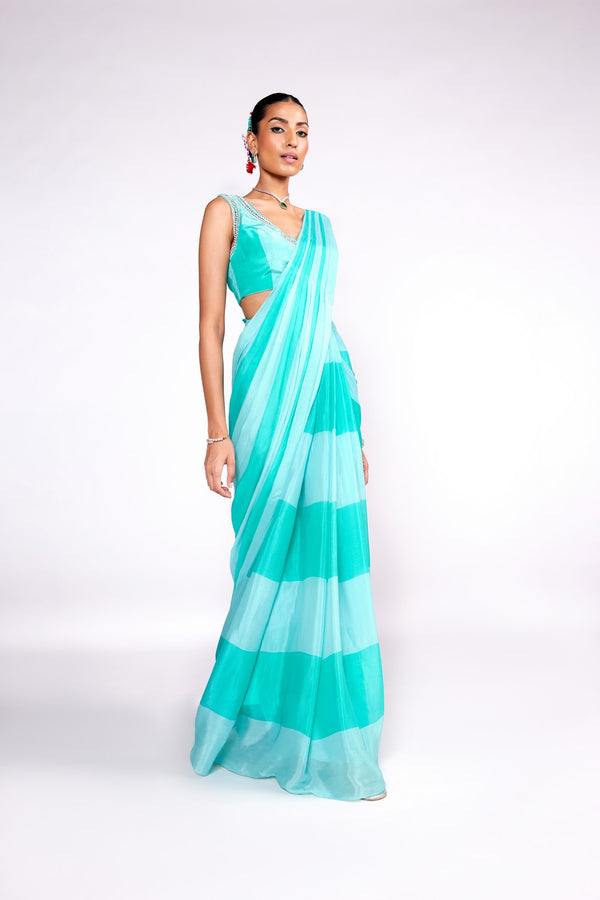 Aqua green color block drape saree